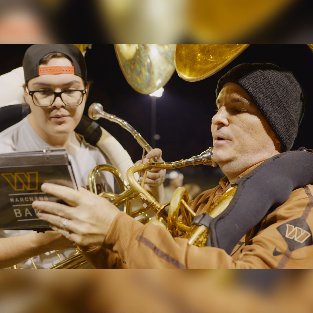 SU Marching Band member Matt Creech with Washington Commanders band member