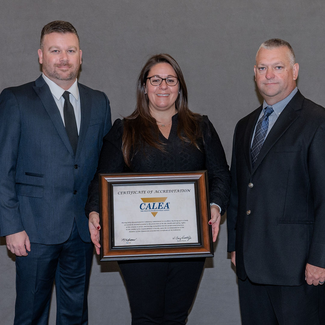 SUPD officials with CALEA reaccreditation certificate